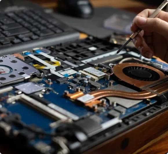 A gaming console being professionally repaired